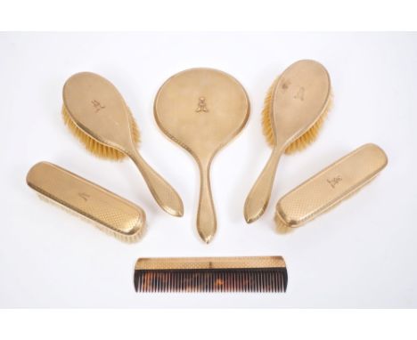 Fine quality gold (9ct) dressing table set - comprising a hand mirror, a pair of hairbrushes, a pair of clothes brushes and a