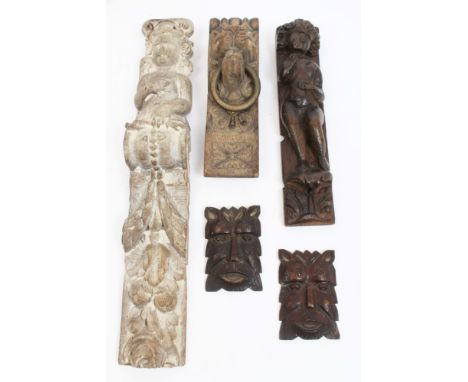 17th century carved lined oak pilaster with Cupid figure issuing foliage, 49cm, together with another smaller 17th century fi