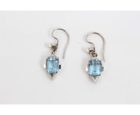 Pair Art Deco aquamarine and seed pearl earrings, each with a rectangular step cut aquamarine in geometric white metal settin