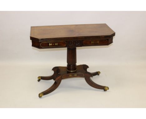 Good Regency rosewood and brass inlaid card table, the canted rectangular foldover top enclosing baize-lined playing surface 