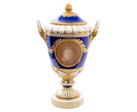 Fine late 18th century Berlin porcelain urn-shaped vase and cover with gilt, white and blue ground and twin mounted leaf hand