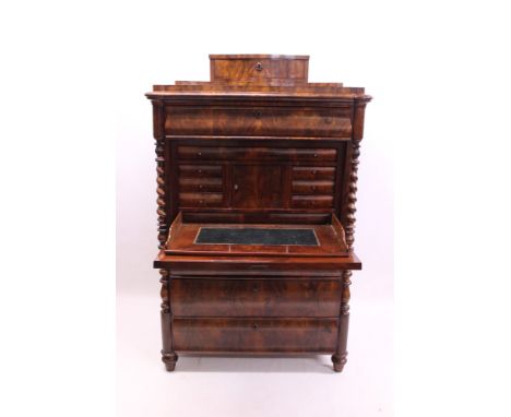 Mid-19th century Continental figured mahogany secretaire abattant surmounted by serpentine shaped drawer, with cushion frieze