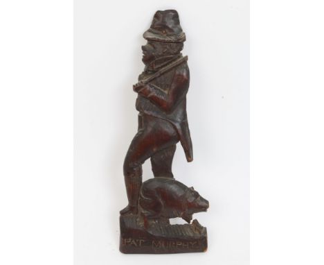 19th century softwood relief folk art carving depicting figure and a pig inscribed below 'Pat Murphy', indistinctly signed ve