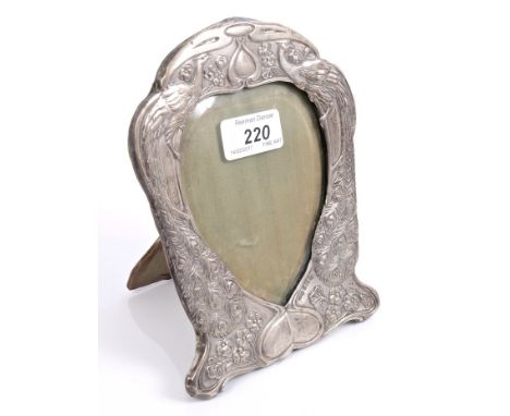 Early Edwardian silver photograph frame with Art Nouveau-style peacock, floral and scrolling decoration and bevelled heart-sh