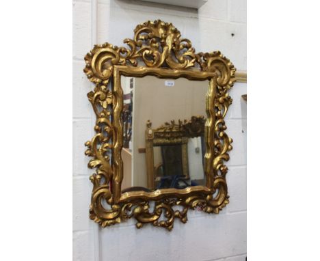 19th century Italian giltwood wall mirror rectangular mirror plate within asymmetric pierced C-scroll surround, 85cm x 66cm