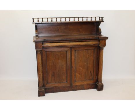 Late Regency rosewood chiffonier, the shelf back with colonnade gallery having cushion frieze drawer over pair of beaded pane