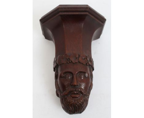 Victorian carved oak corbel - having faceted shelf, on finely carved terminal in the form of a bearded man's head with foliat