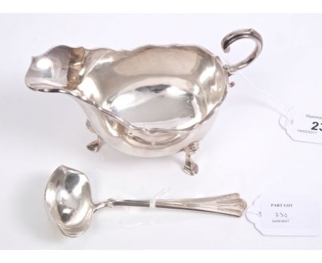 1920s silver sauce boat of conventional form, with open scroll handle, on three hoof feet (Chester 1928), maker - D. S. N., t