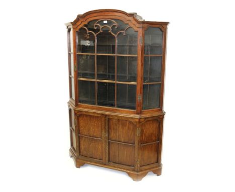 19th century Dutch oak standing display cabinet enclosed by astragal glazed door with canted glazed sides and enclosed panell