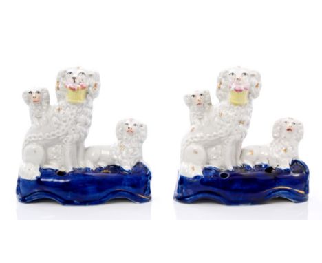 Pair Victorian Staffordshire poodle with puppies inkwells with baskets of flowers in mouths, 14cm high   CONDITION REPORT  On