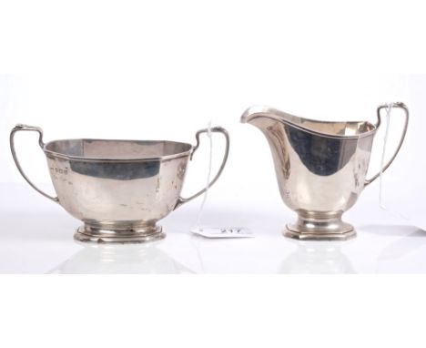 1930s silver cream jug of octagonal faceted form, in the Art Deco style, with angular loop handle, on flared base, together w