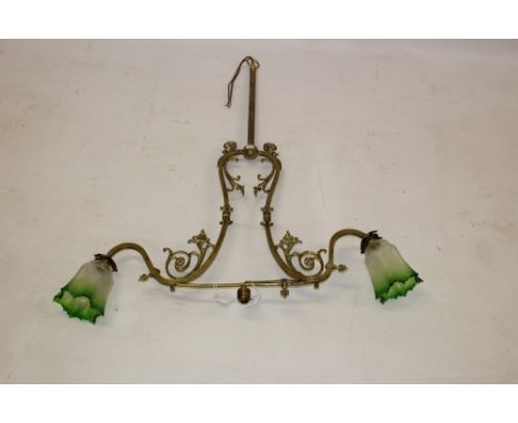 Ornate Victorian-style ceiling light, central drop column issuing twin leaf capped dome, scrolling arms with green glass shad