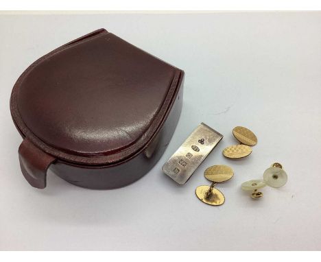 A Hallmarked Silver Ingot Tie Slide, Sheffield 2001, together with a pair of gilt coloured cufflinks, machine turned style de