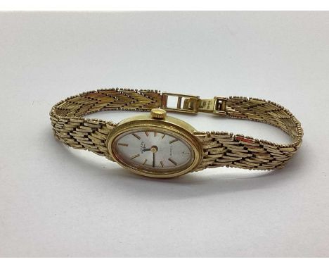 Rotary; A 9ct Gold Cased Ladies Wristwatch, the signed oval dial with line markers, within plain case, to integral fancy link