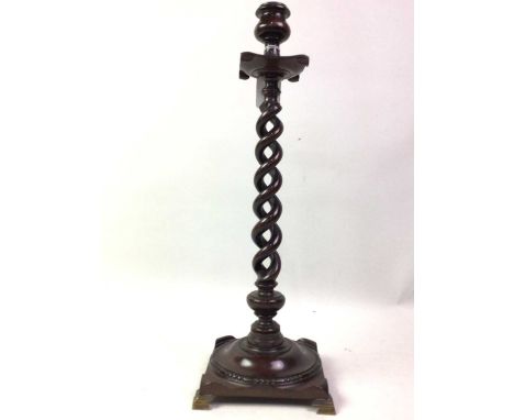 MAHOGANY TWIST COLUMN CANDLESTICK, EARLY 20TH CENTURY with single open twist design column, on turned base and raised on four