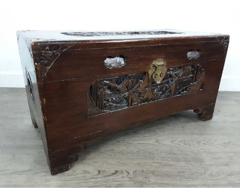 CHINESE CAMPHOR WOOD BLANKET CHEST, with carved designs on raised supports32cm high, 72cm wide, 35cm deep