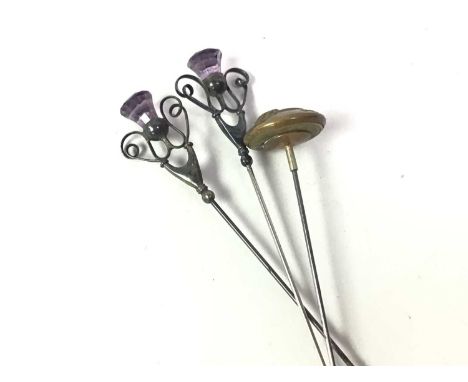TWO SILVER THISTLE END HAT PINS, BIRMINGHAM 1910 with amethyst coloured glass finials and another military button hat pin29CM