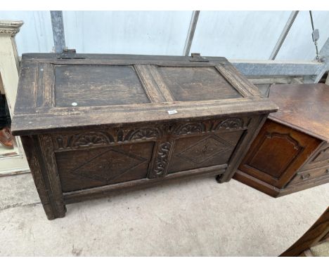 A GEORGE III OAK BLANKET CHEST WITH TWO PANEL CARVED FRONT, 43.5" WIDE 