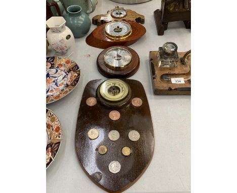 A BAROMETER DECORATED WITH BRITISH COINS TO INCLUDE NEW PENCE TOGETHER WITH A SMALL CIRCULAR MAHOGANY BAROMETER AND OTHERS 