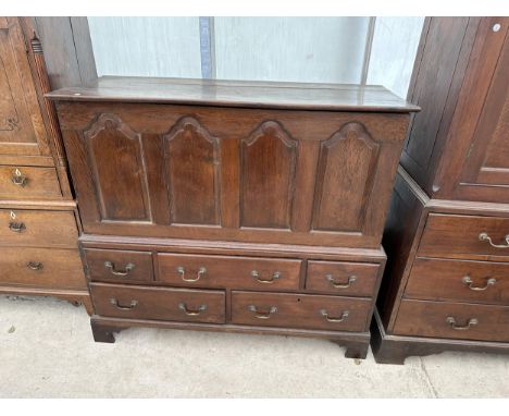 A GEORGE III WELSH OAK BLANKET CHEST WITH FOUR PANEL FRONT ON BASE, ENCLOSING TWO SHORT AND THREE LONG DRAWERS, ON BRACKET FE