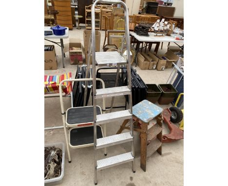 A FOUR RUNG ALUMINIUM STEP LADDER, A TWO RUNG TAURUS STEP AND A VINTAGE WOODEN TWO RUNG KITCHEN STEP 