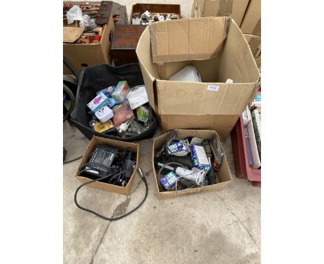 AN ASSORTMENT OF ITEMS TO INCLUDE LIGHT BULBS AND A BATTERY CHARGER ETC 