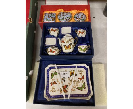 A MINIATURE TEASET WITH BUTTERFLY DECORATION PLUS THREE CERAMIC TRINKET BOXES WITH BUTTERFLY DESIGN - BOTH AS NEW AND BOXED 
