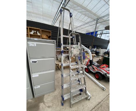 A LARGE 6 RUNG ALUMINIUM ABRU STEP LADDER AND A FURTHER 4 RUNG ALUMINIUM STEP LADDER 
