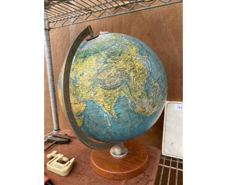 A VINTAGE WORLD GLOBE WITH A WOODEN BASE 