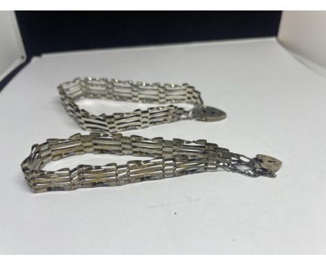 TWO SILVER FOUR BAR GATE BRACELETS WITH HEART PADLOCK FASTENERS 