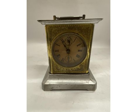 A VINTAGE BRASS AND METAL MANTLE CLOCK 