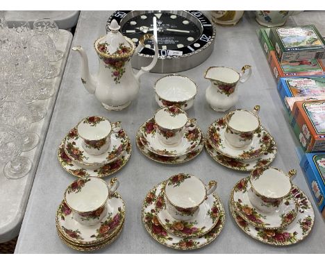 A ROYAL ALBERT COFFEE SET TO INCLUDE A COFFEE POT, SUGAR BOWL, CREAM JUG, CUPS, SAUCERS AND SIDE PLATES 