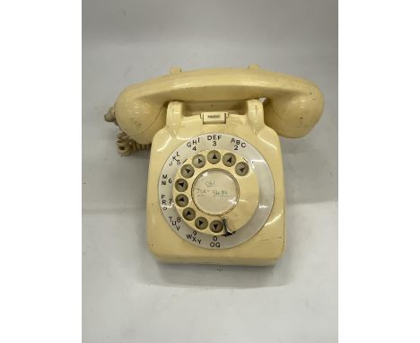 A VINTAGE CREAM ROTARY DIAL TELEPHONE 