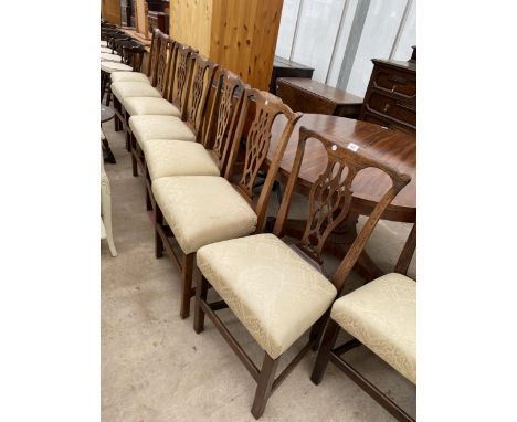 A SET OF SIX OAK PIERCED SPLAT BACK CHIPPENDALE STYLE DINING CHAIRS 