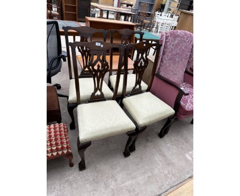 A SET OF FOUR MAHOGANY CHIPPENDALE STYLE DINING CHAIRS ON CABRIOLE LEGS WITH BALL AND CLAW FEEET 
