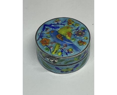 A SILVER CIRCULAR PILL BOX WITH ENAMEL BIRD DESIGN LID AND SIDES 