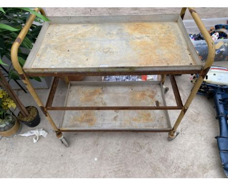 A THREE TIER METAL FOUR WHEELED TROLLEY (ONE SHELF MISSING) 