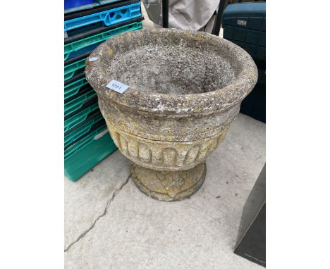 A RECONSTITUTED STONE GARDEN PLANTER 
