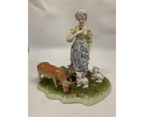 A VINTAGE CERAMIC TABLEAU OF A LADY WITH FARM ANIMALS WITH BLUE CROSSED SWORDS AND R TO BASE 
