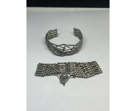 A SILVER SEVEN BAR GATE BRACELET WITH HEART PADLOCK AND A SILVER WEAVE DESIGN BANGLE 