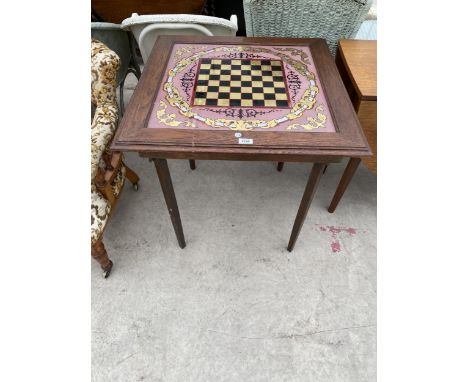 A CHESS/DRAUGHT'S BOARD TABLE WITH GLASS TOP ON FOLDING LEGS 28" SQUARE 