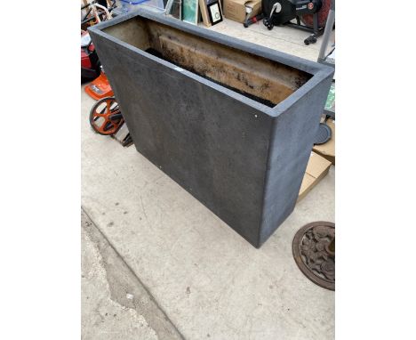 A TALL BLACK FIBRE GLASS TROUGH PLANTER (H:90CM L:120CM D:35CM) 