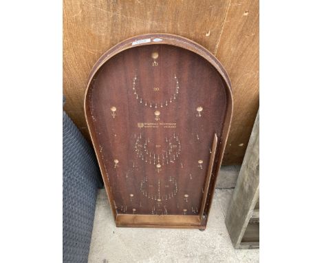 A VINTAGE WOODEN BAGATELLE GAME BEARING THE NAME BRAMHALL WOODWARE SHEFFIELD AND WITH AN ASSORTMENT OF BALLS 