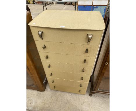 A MID 20TH CENTURY LIGHT OAK CHEST OF SEVEN DRAWERS WITH ORIGINAL BRASS DOOR KNOBS, 25.5" WIDE 