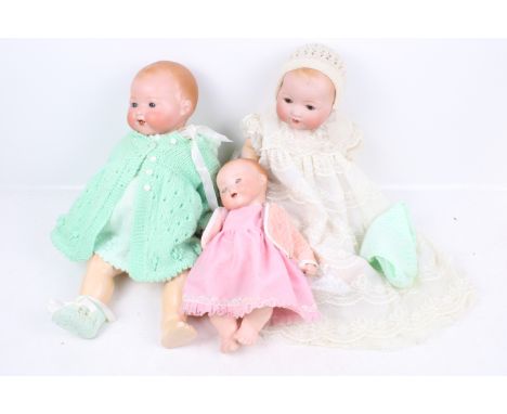 Three vintage Armand Marseille bisque headed dolls. All having painted features, blue blinking eyes and open mouths, numbered