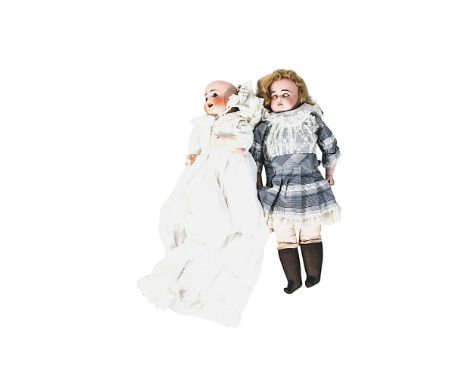 Two vintage bisque headed dolls. Comprising an Armand Marseille doll with painted features, brown blinking eyes and a blonde 