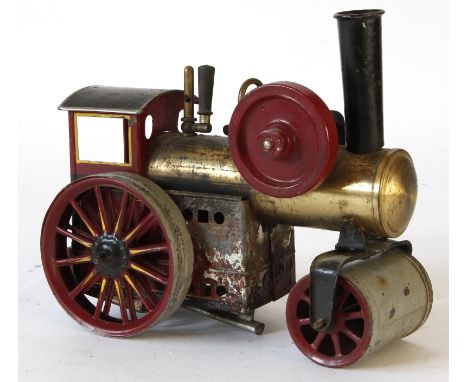 A Bing (Germany) live steam steam roller 
In maroon black and brass colour with flywheel and burner.