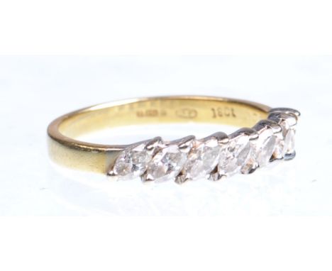 An 18ct gold diamond set half eternity ring 
Set with seven offset marquise diamonds to plain band, estimated total diamond w