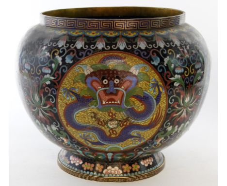 A Chinese cloisonné jardinière, Late Qing Dynasty (1644-1912)
Of rounded ovoid form, raised on a spreading circular base, the