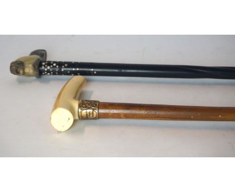 An early 20th Century horn handle walking stick
With gilt metal terminal entitled 'A.Howard Moss Esq' together with a further